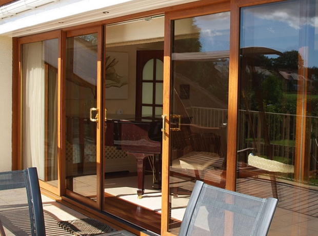 Modern composite door design with wood-grain effect for front homes.