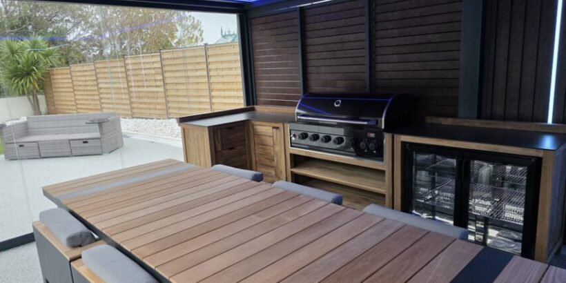 A home in Swansea with a pergola.